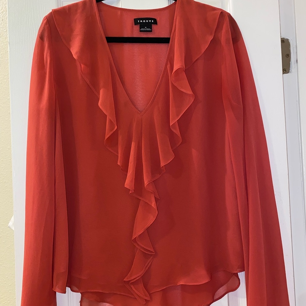 orange/coral Trouve blouse. subtle ruffles on the neckline. subtle flare sleeves